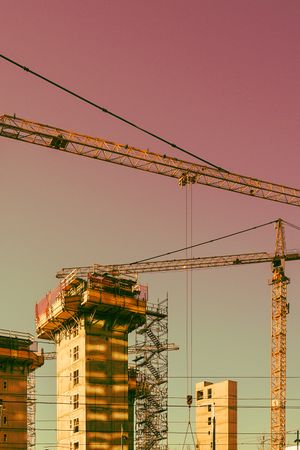 Construction cranes at an industrial site