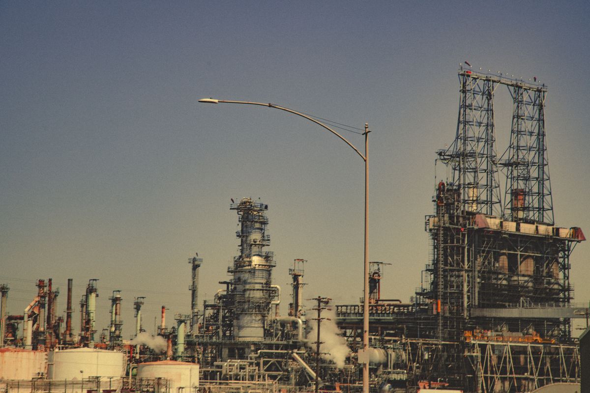 A refinery and towers at dusk
